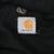 Close-up of Carhartt logo tag on the jacket's black lining