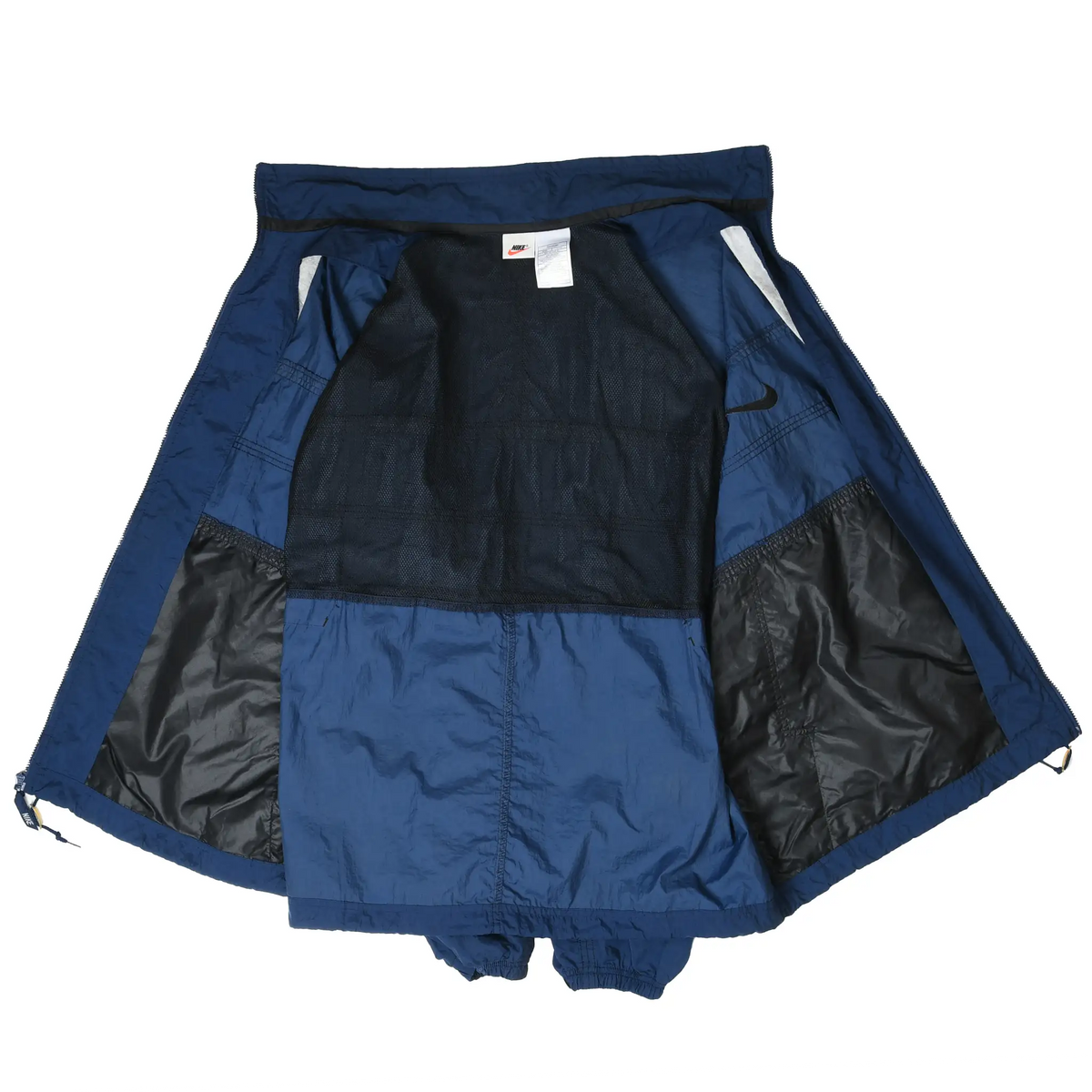 Navy blue Nike windbreaker opened to show black mesh lining and interior panels