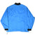 Back of blue Nike windbreaker jacket with black cuffs and adjustable drawcord hem