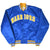 Full front of blue Warriors snap jacket with striped collar, cuffs and waistband