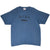 Full front view of blue-grey Nike T-shirt with black Nike Athletics chest graphic