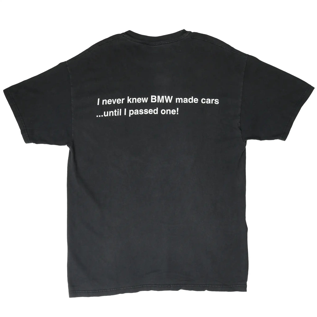 Back of black BMW T-shirt with white text reading “I never knew BMW made cars ...until I passed one!”