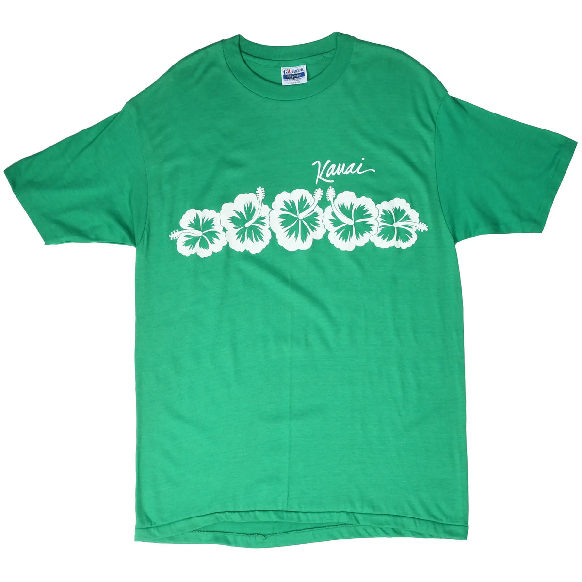 Full front view of green Kauai T-shirt with white hibiscus print
