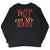 Back of black long-sleeve shirt with red and yellow Blame It All on My Roots print
