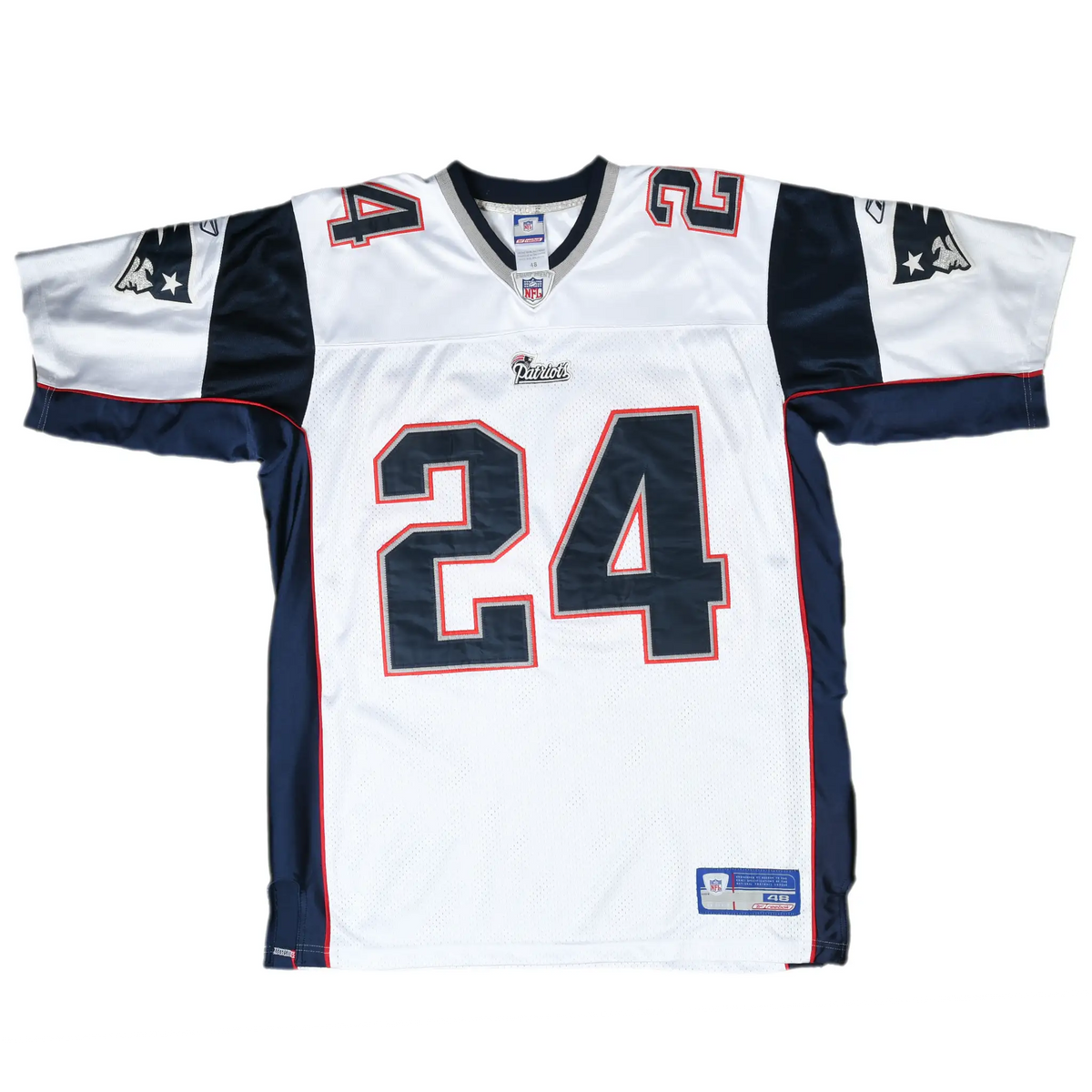 Front of white New England Patriots Reebok jersey with navy number 24 and team sleeve logos
