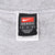 Close-up of Nike Team medium neck label inside grey sweatshirt