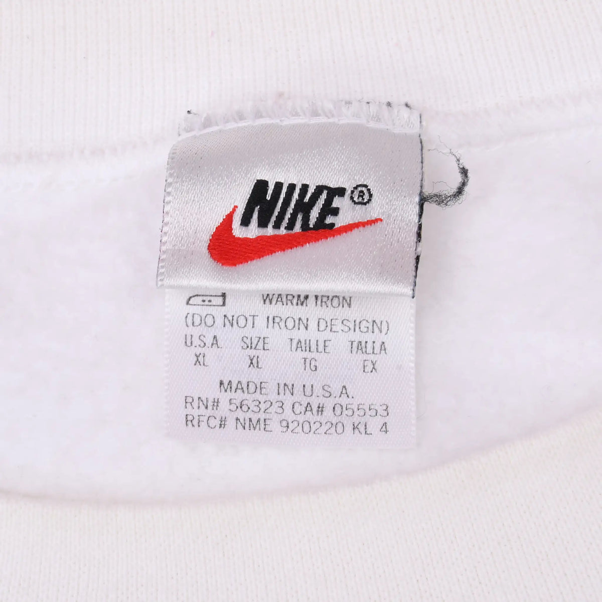 Nike neck label showing red Swoosh, size XL, and Made in U.S.A. text