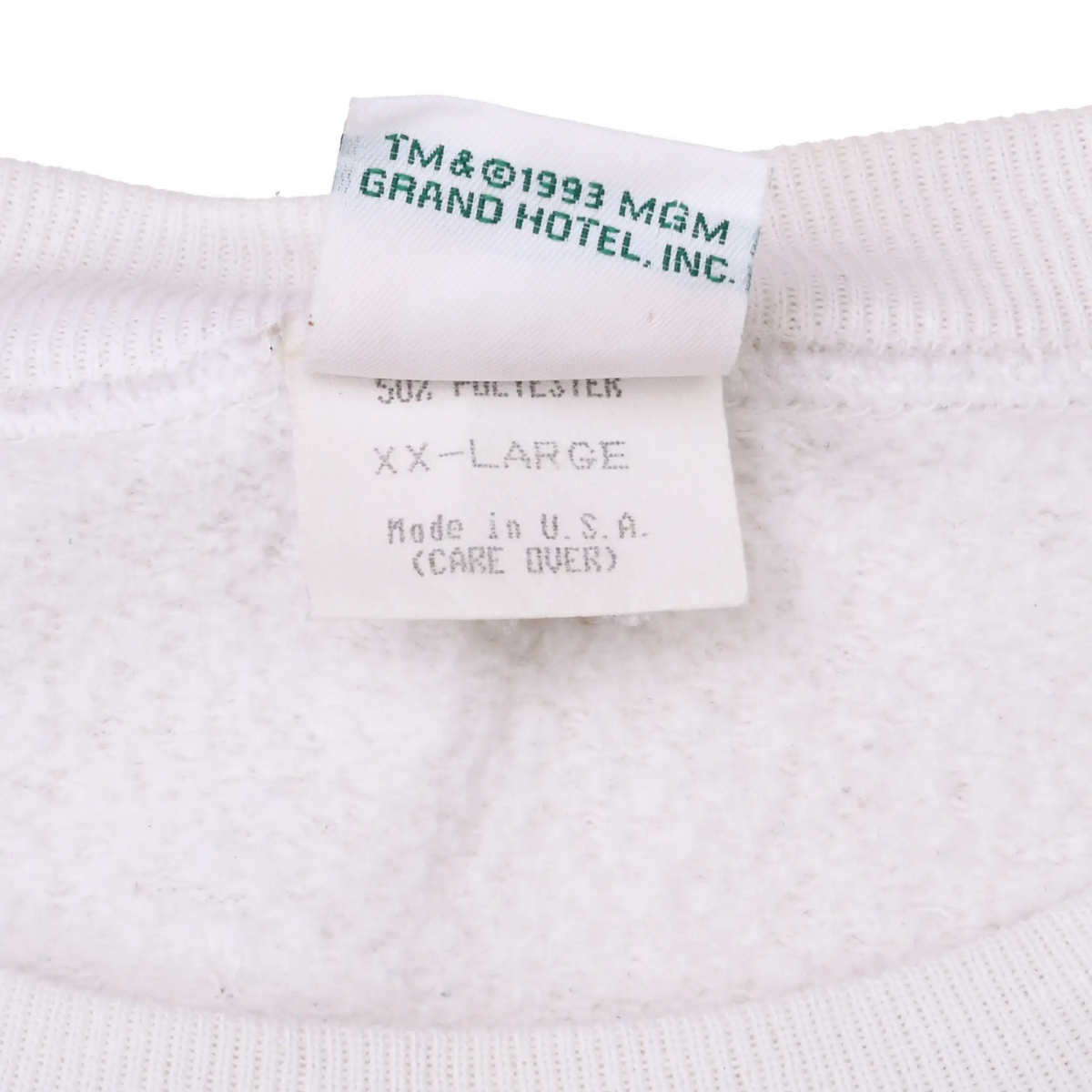 Close-up of sweatshirt tags showing 1993 MGM Grand Hotel, XX-Large, and Made in USA text