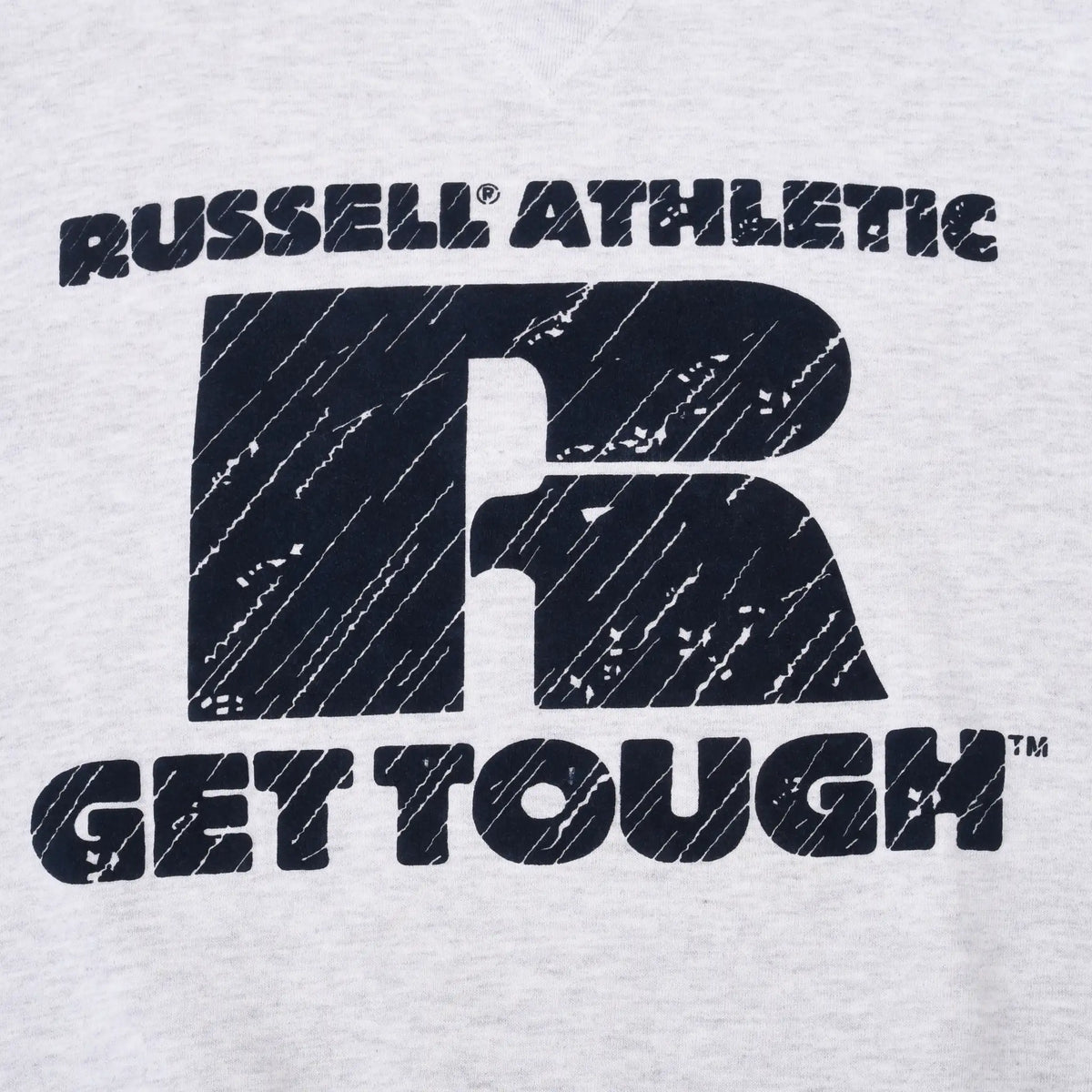 Close-up of distressed black Russell Athletic R logo and Get Tough chest print