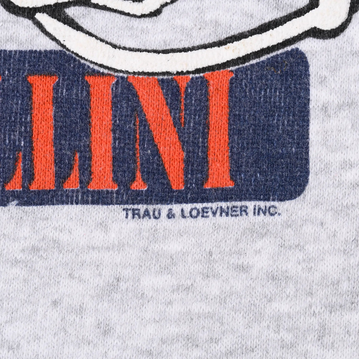 Close-up of Fighting Illini print showing Trau & Loevner Inc. text