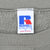 Close-up of Russell Athletic neck label inside taupe sweatshirt