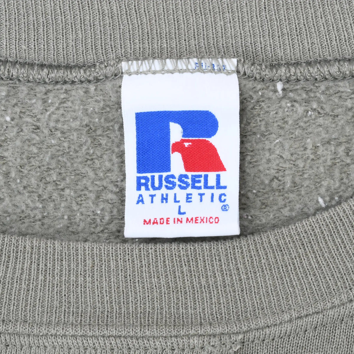 Close-up of Russell Athletic neck label inside taupe sweatshirt
