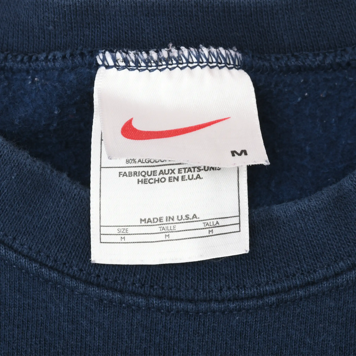 Nike neck label with red Swoosh, medium size, and Made in U.S.A. text