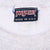 Close-up of Jansport Made in U.S.A. neck label on gray sweatshirt