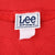 Close-up of Lee Sport neck label inside red sweatshirt