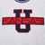 Close-up of navy and red Kansas U appliqué on grey sweatshirt front