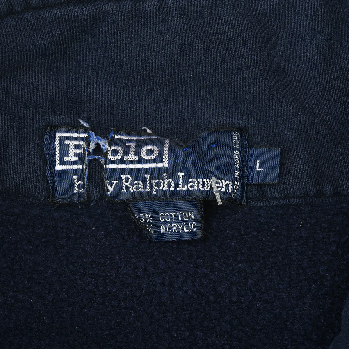 Close-up of Polo by Ralph Lauren neck label and large size tag