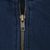 Close-up of brass-tone YKK quarter zipper on navy sweatshirt