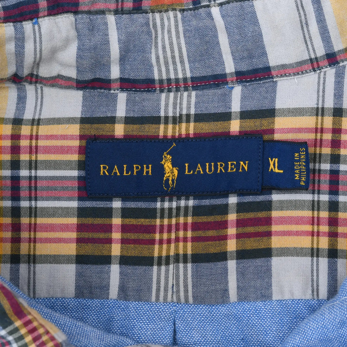 Close-up of Ralph Lauren neck label marked XL and Made in Philippines