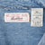 Levi Strauss Signature neck label and 2XL care tag inside blue denim shirt