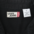 Close-up of Levi's Jeans neck label and large size tag inside black denim shirt