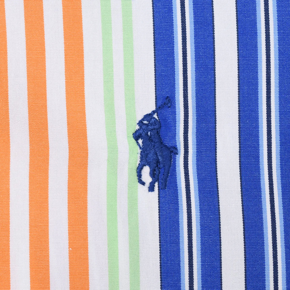 Close-up of blue Ralph Lauren pony embroidery on multicolor striped fabric