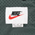 Nike neck label and XL size tag on green mesh lining