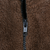Close-up of black YKK zipper on brown fleece fabric