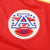 Close-up of embroidered American Football League patch on red jersey
