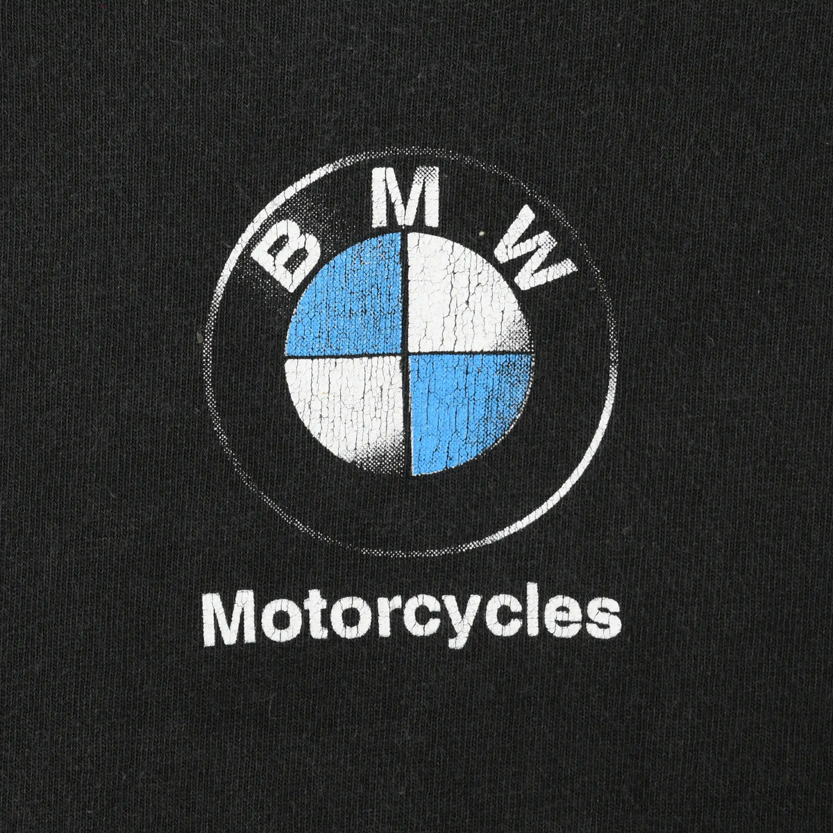 Close-up of blue and white BMW roundel and Motorcycles chest print
