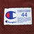 Champion jersey hem label marked 44 with care instructions