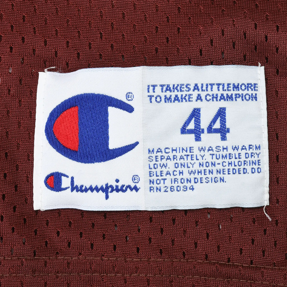 Champion jersey hem label marked 44 with care instructions
