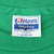 Close-up of Hanes Fifty-Fifty XL 46-48 neck tag on green T-shirt
