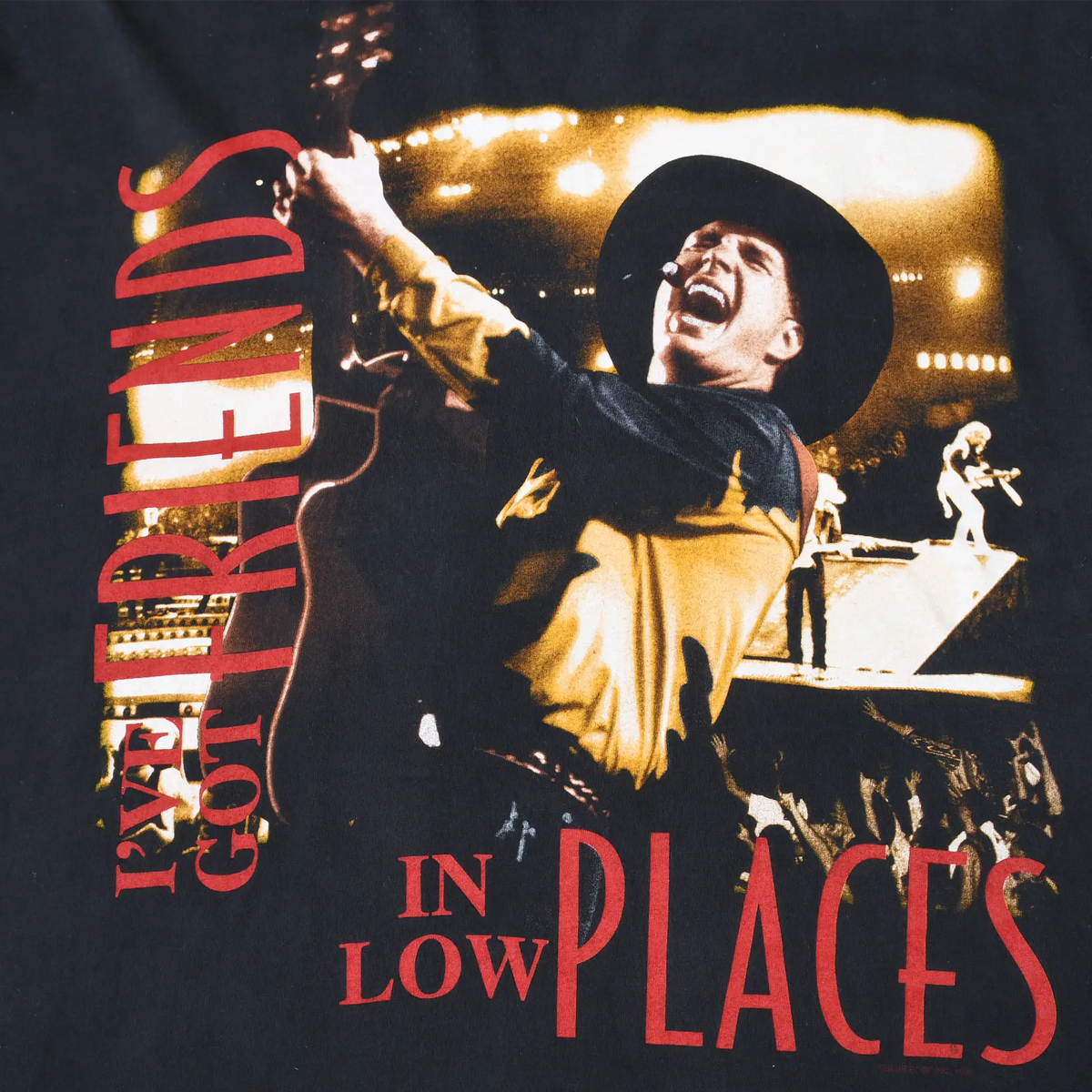 Close-up of Garth Brooks concert graphic with Friends in Low Places text