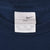 Close-up of Nike XXL neck label inside navy blue T-shirt