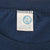 Close-up of Artex neck tag marked XL inside navy Chicago Bears T-shirt
