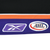 Close-up of Reebok and AHL logo patches on purple jersey hem