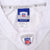 Close-up of Reebok NFL Equipment medium neck label and embroidered NFL collar shield