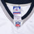 Reebok NFL neck tag marked 48 and embroidered NFL shield on white jersey collar