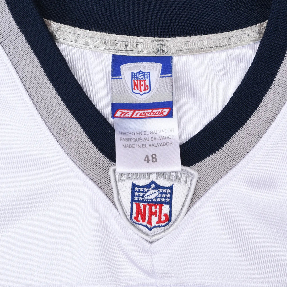 Reebok NFL neck tag marked 48 and embroidered NFL shield on white jersey collar