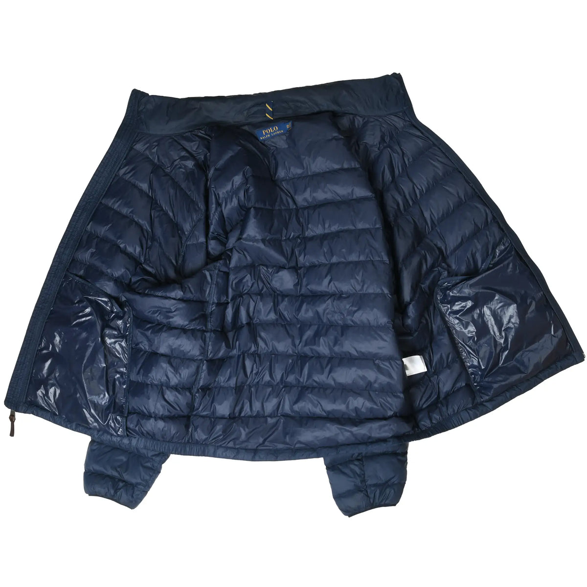 Open Polo Ralph Lauren puffer jacket showing navy quilted interior and inner pockets
