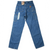 Back of Carhartt blue carpenter jeans with patch pockets, utility pockets, tags, and logo patch