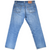 Back view of Levi's 501 blue jeans with two stitched pockets, red tab, and waistband patch