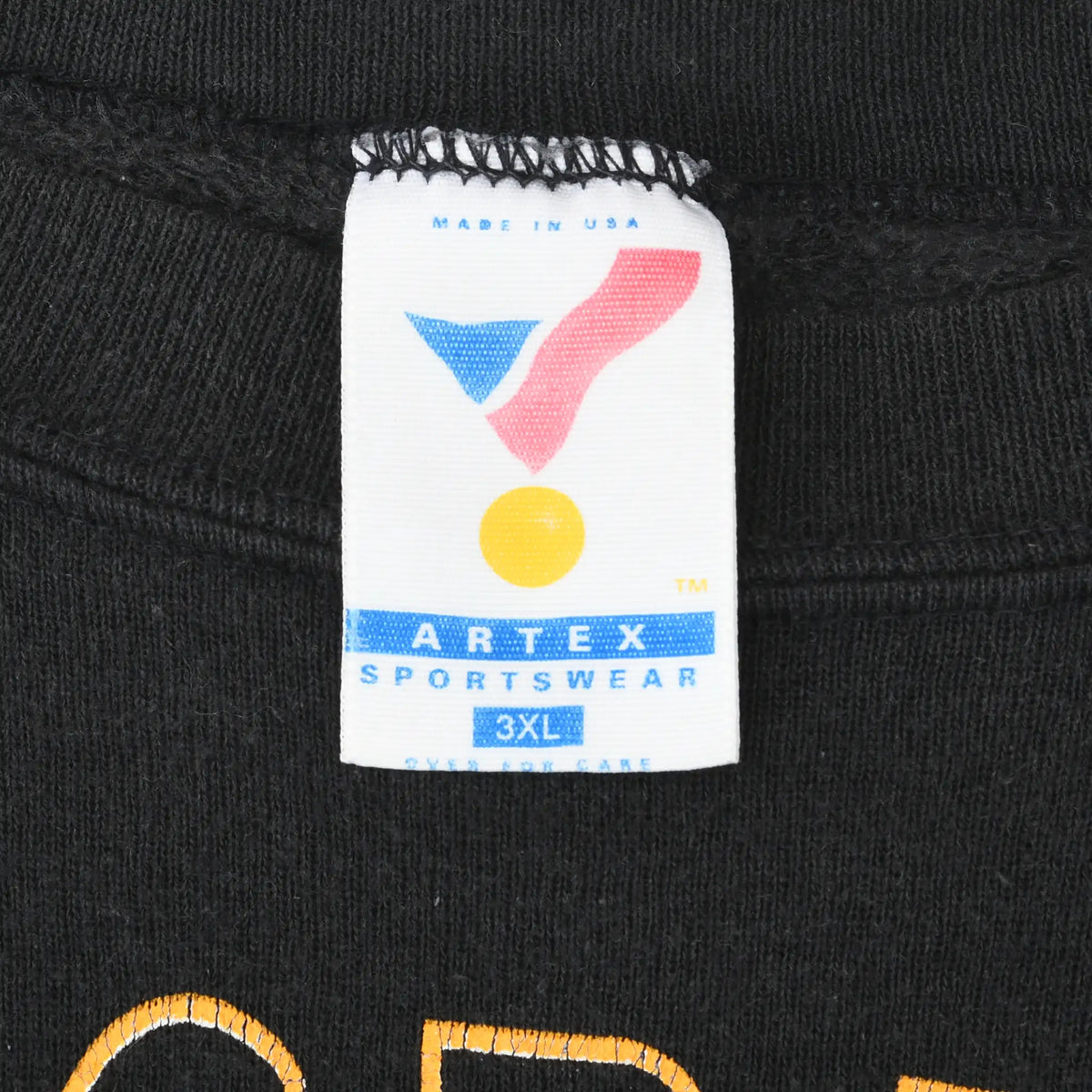 Close-up of Artex Sportswear 3XL Made in USA neck tag on black sweatshirt