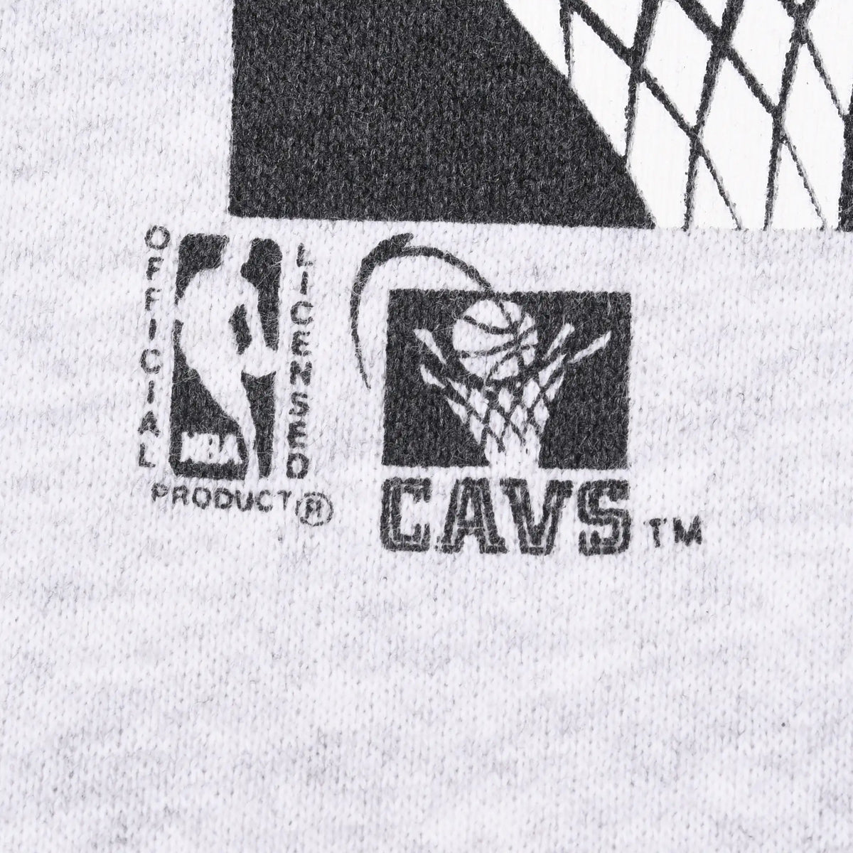 Close-up of NBA licensed product and Cavaliers logos printed on gray fabric