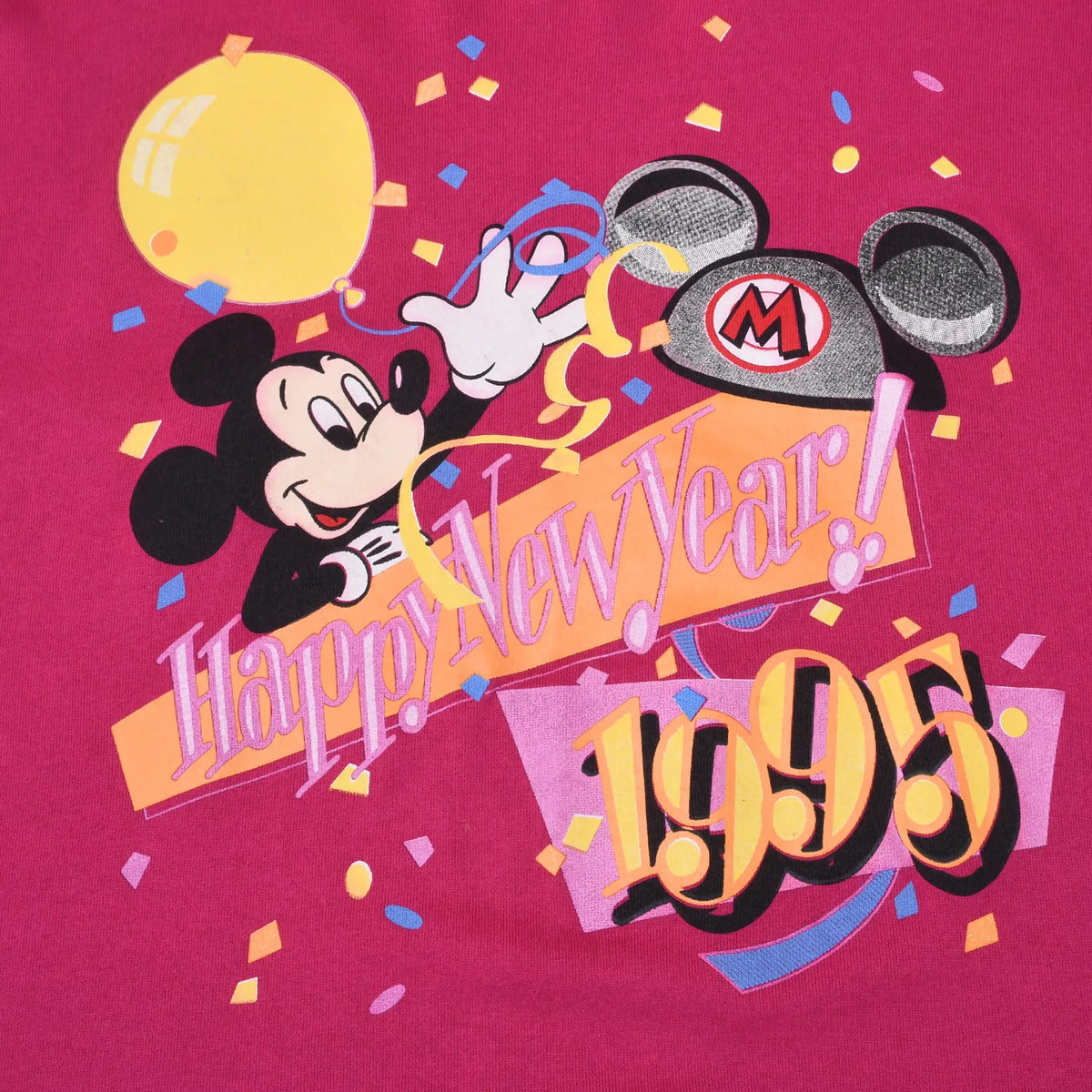 Close-up of Mickey Mouse, balloon, hat and Happy New Year 1995 sweatshirt graphic