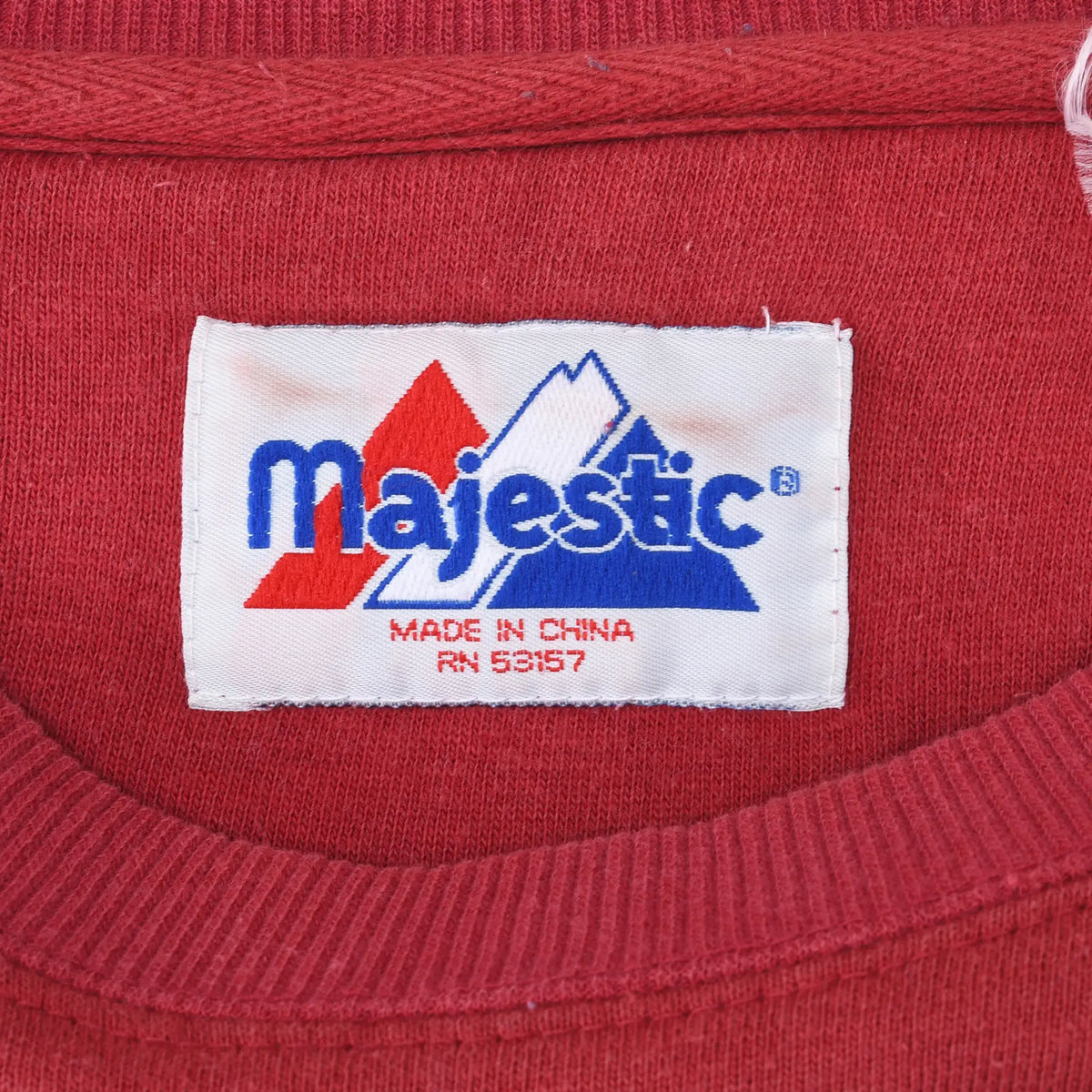 Close-up of Majestic neck label marked Made in China RN 53617