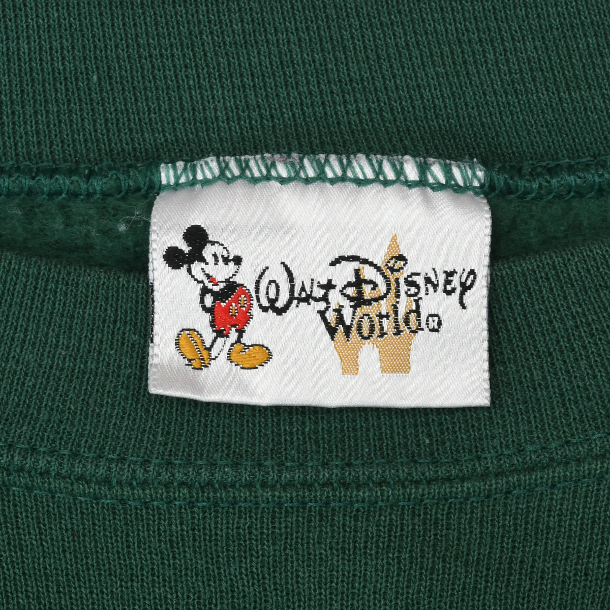 Close-up of Walt Disney World neck label with Mickey Mouse and castle