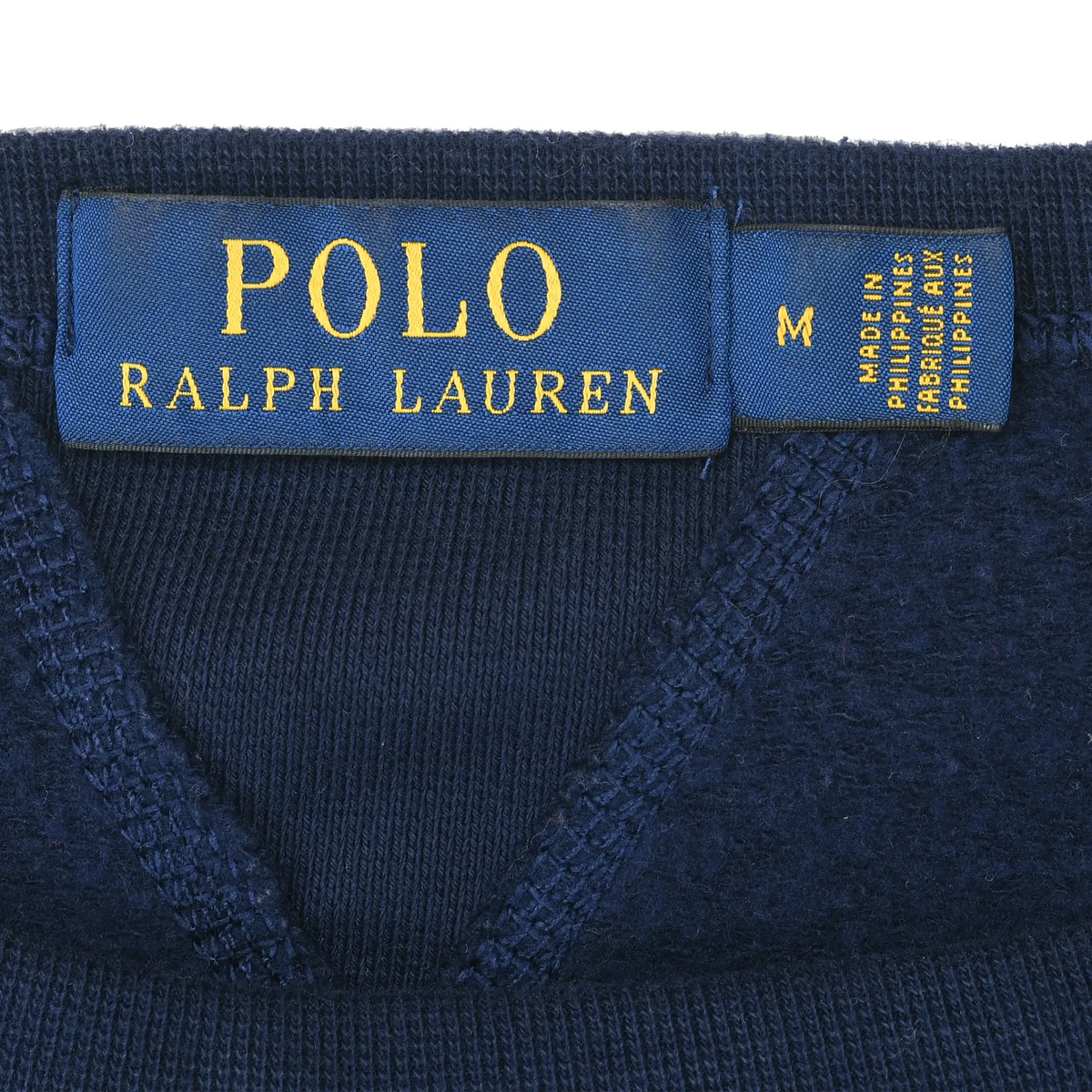Close-up of blue and yellow Polo Ralph Lauren neck and size labels