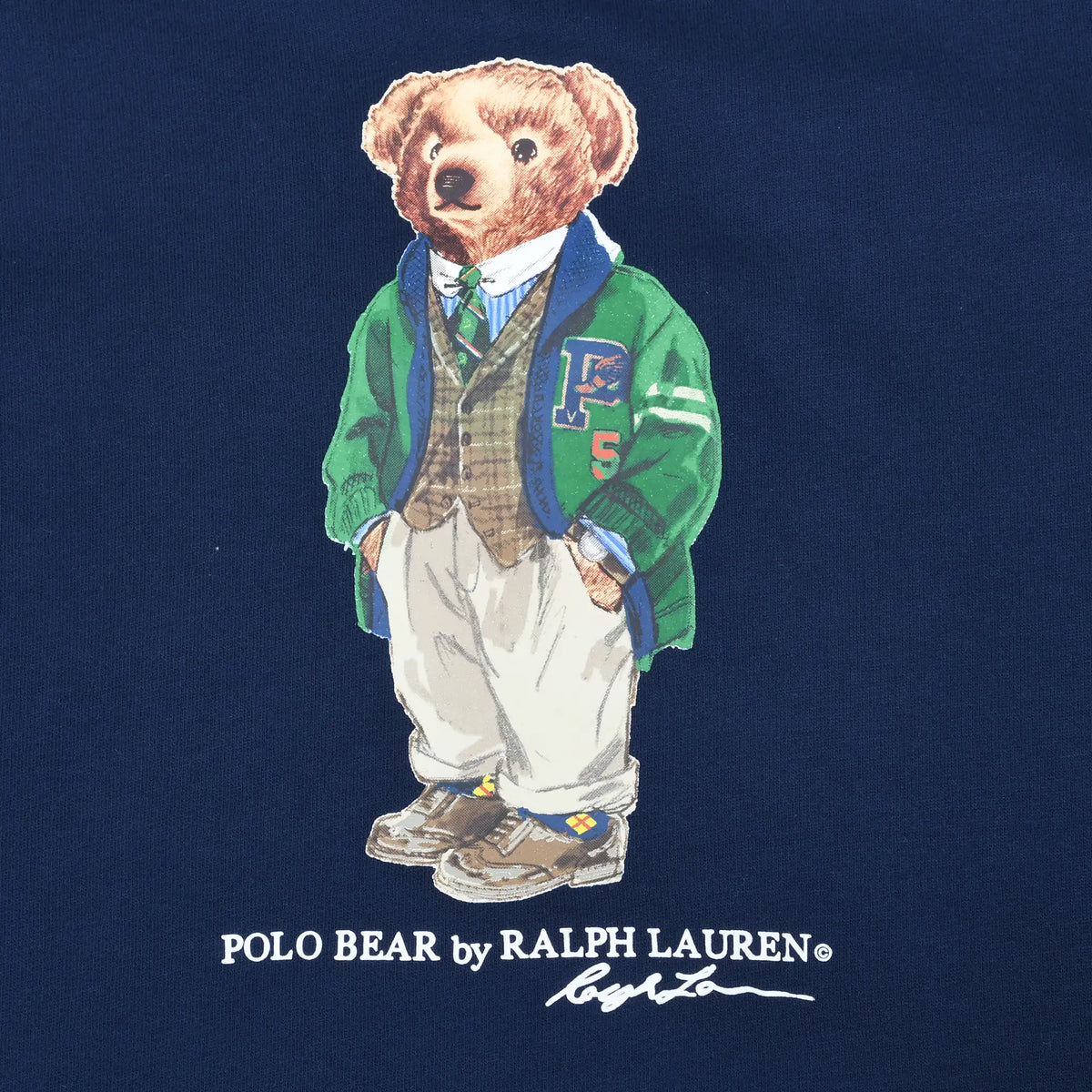 Close-up of Polo Bear graphic in green jacket on navy sweatshirt